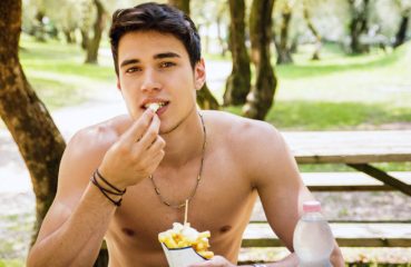 man eating fries