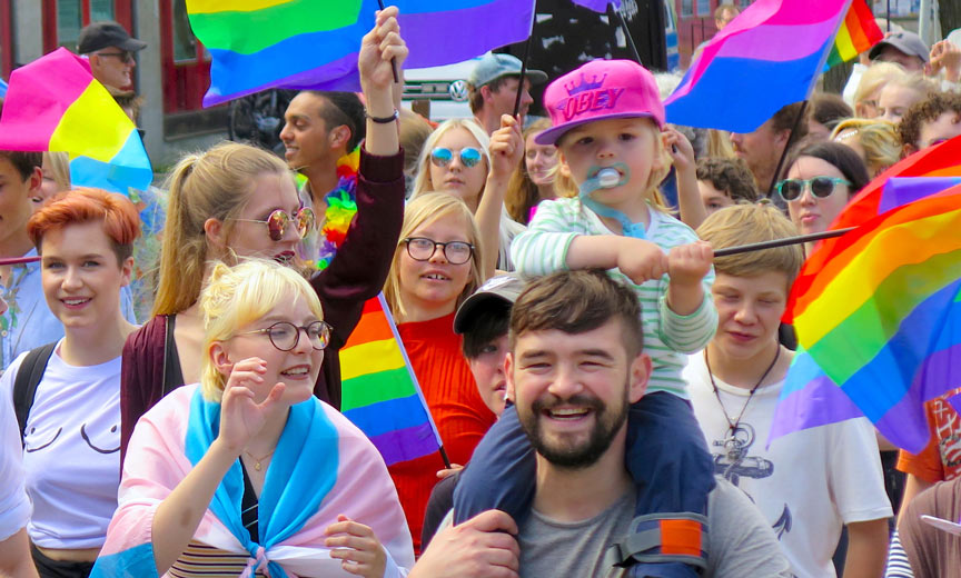 families marching in Pride parade
