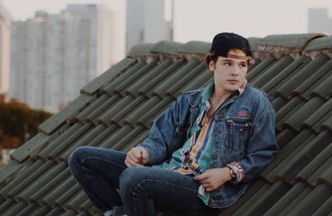 young man on a city rooftop