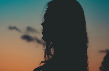 woman in profile at dusk