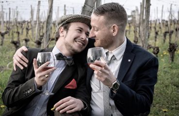 gay couple toasting