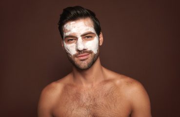 Man Using Facial Scrub